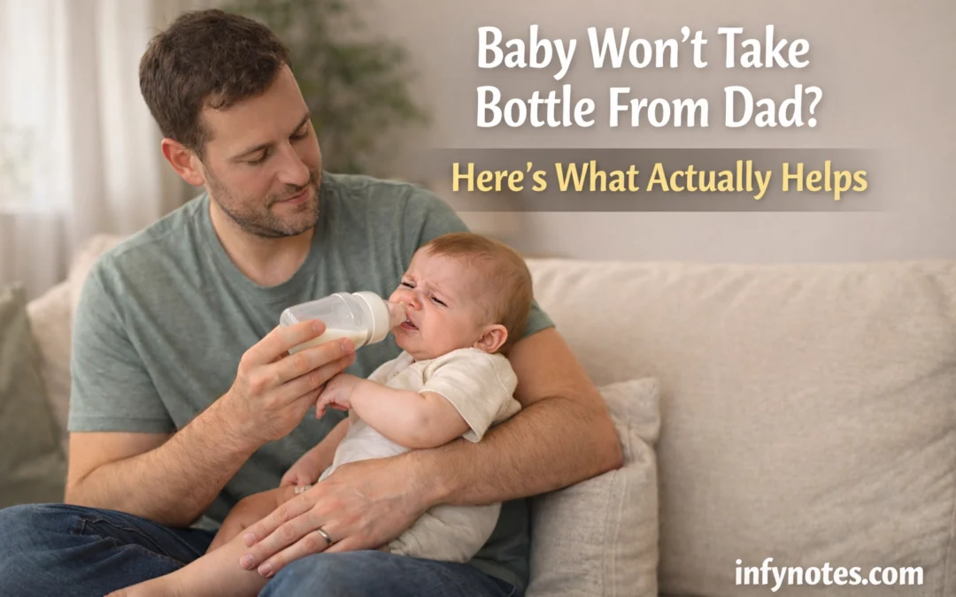 Dad gently offering a bottle to a fussy baby on a sofa in soft natural light